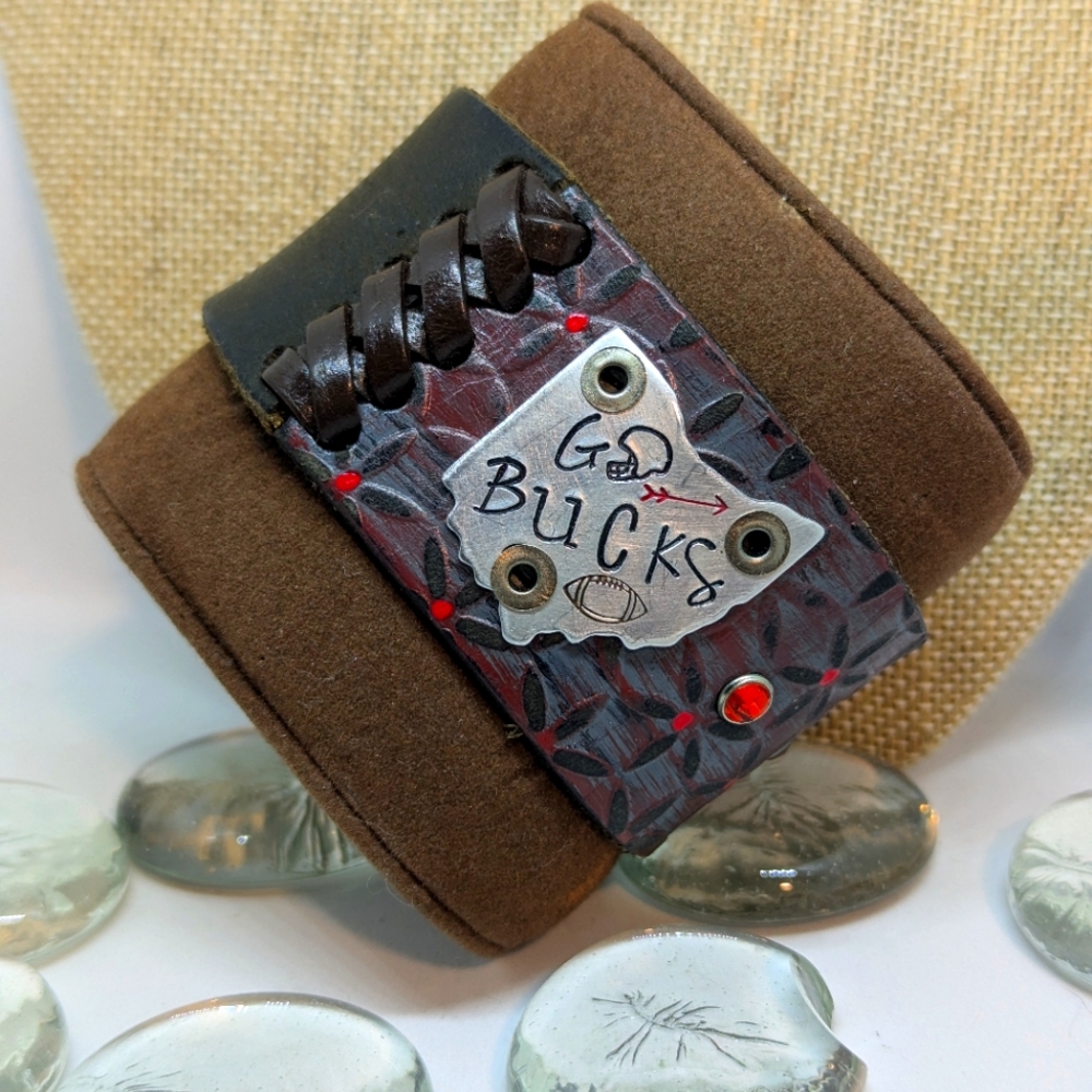 Curious Cuffs Go bucks! Leather snap bracelet.